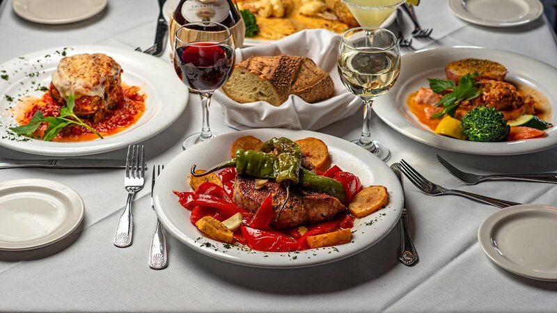 Steak entree topped with hot peppers and potatoes