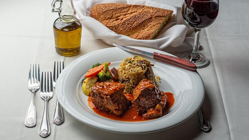 Beef entree with side of rice and vegetables