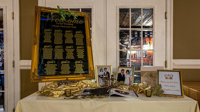 Ceremony table with photographs and guest list