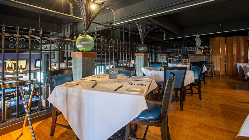 Upstairs dining room seating with set tables