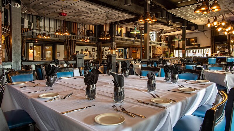 Dining room interior with focus on table set for many guests